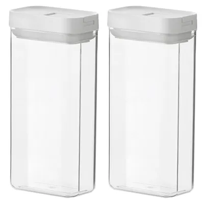 Two clear plastic food storage containers with white lids are shown side-by-side against a white background.