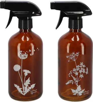 Two brown glass spray bottles with black spray tops, each decorated with a white botanical illustration.