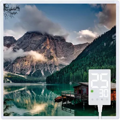 A digital display unit is placed in front of a scenic mountain lake landscape.