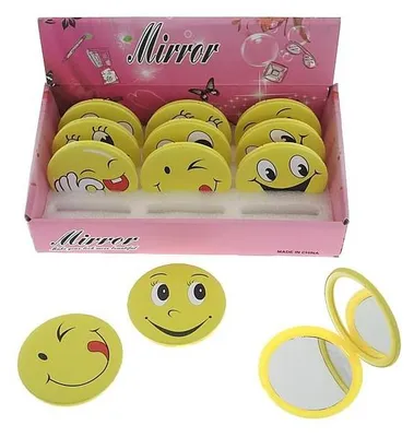 A display box of yellow smiley face mirrors, with some mirrors laid out in front of the box.