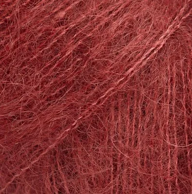 A close-up view of red yarn.