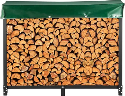 A firewood rack filled with logs, covered by a green tarp.