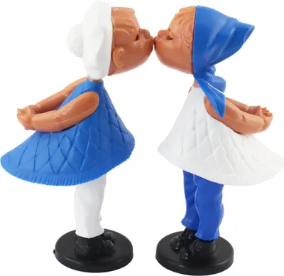 Two kissing dolls on a white background.