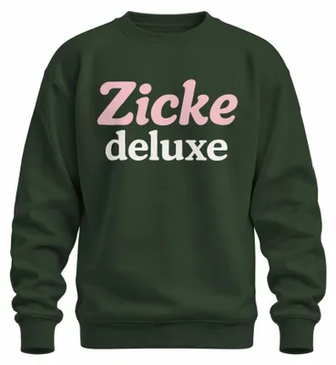 Productafbeelding van "Zicke Deluxe" - Vrolijke en opvallende trui/pullover voor dames, in roze pastelkleur, met een grappige tekst. Verkrijgbaar in de kleur flessengroen, maat M