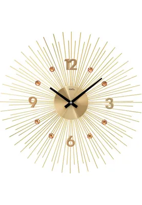 A golden sunburst wall clock with black hands and amber-colored decorative stones.