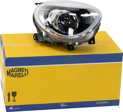 A car headlight is placed on top of its packaging box.