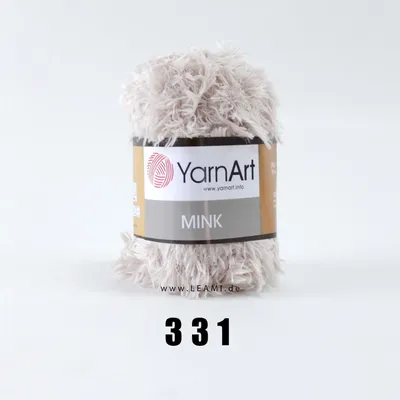 A ball of YarnArt Mink yarn on a white background.