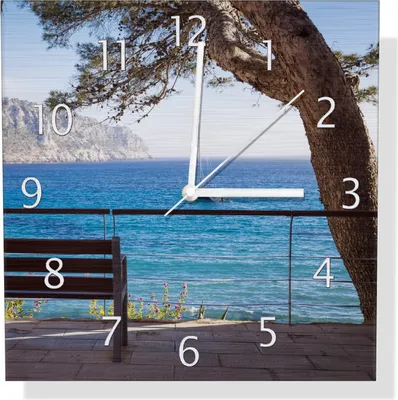 Produktbild von Wallario Design Wanduhr Einsame Bank am Meer - Spanien im Sommer aus Aluverbund, Größe 30 x 30 cm