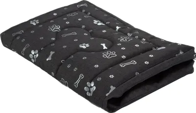 A dark gray dog bed with paw print and bone patterns, shown from a diagonal angle.