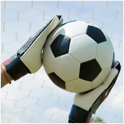 Produktbild von Wallario Memoboard Magnettafel aus Glas, Größe 50 x 50 cm, Motiv Fußball - Torwart im Tor vor blauem Himmel