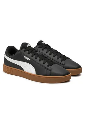 A pair of black Puma sneakers with white accents and a brown sole, presented on a white background.