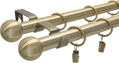 A close-up studio shot of a double curtain rod set.