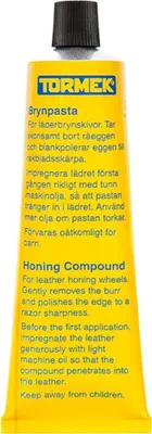 A yellow tube of Tormek honing compound with black text and a black cap.