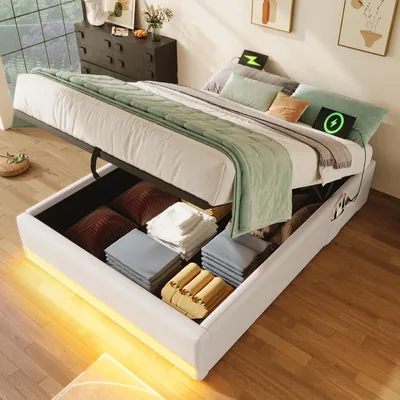 A bed with storage is open, revealing folded blankets and pillows inside. The bed is made with green and white bedding, and there are two glowing green symbols on the pillows.