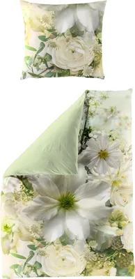 A pillow and a duvet cover with a floral pattern.
