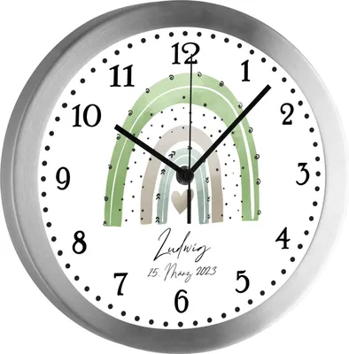 A close-up view of a round wall clock with a rainbow design and personalized text.