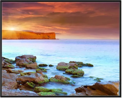 Produktbild von Wallario Wandbild Sonnenaufgang am Meer mit Landzunge und Felsen im Wasser, Größe: 40,30 x 50,30 cm, Poster mit schwarzem Aluminiumrahmen