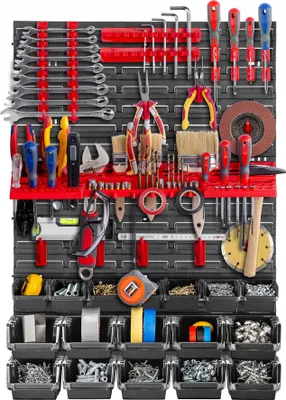 A well-organized tool wall with various tools and storage bins.