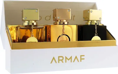 A gift set of three Armaf perfumes in a white and gold box.