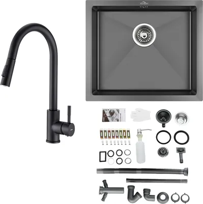 A kitchen sink and faucet set with various accessories laid out on a white background.