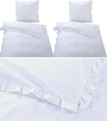 A set of white bedding with ruffles, including two duvet covers and two pillowcases, displayed against a white background.