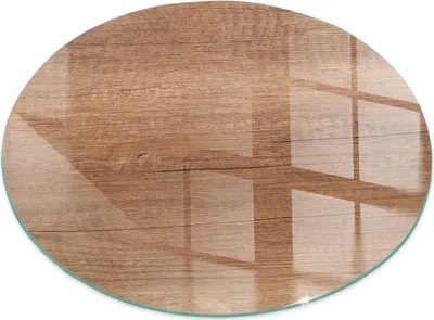 A round glass plate with a wood grain pattern, reflecting light.