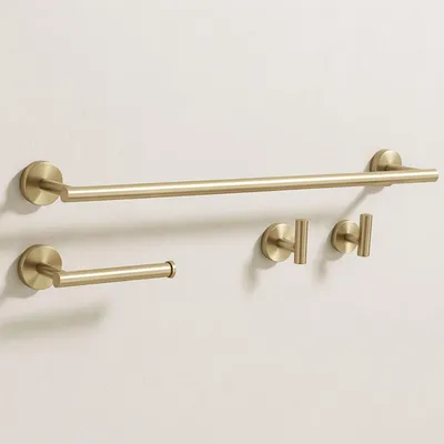 A set of bathroom hardware, including a towel bar, toilet paper holder, and two hooks, mounted on a light-colored wall.