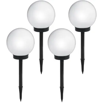 Four white globe-shaped garden lights on black stakes against a white background.