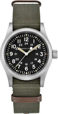 A close-up studio shot of a Hamilton Khaki Field Mechanical watch with a green NATO strap.