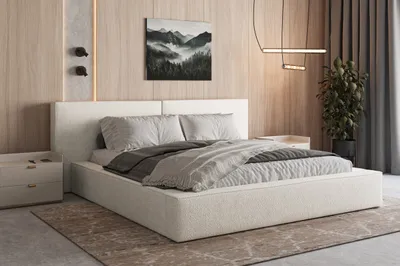 A modern bedroom with a bed, nightstand, and artwork.