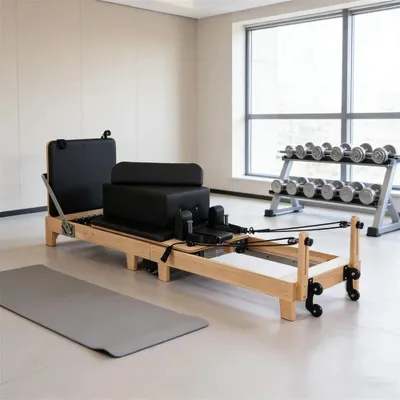 Obrázok produktu pre Pilates Reformer – štúdiový model – javorové drevo – skladací – nastaviteľný odpor – 240 × 60 × 30 cm – čierny