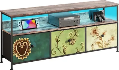 Produktbild von Szafka pod telewizor Fortuna Lai 108x30x57 cm z oświetleniem LED, 4 kolorowymi szufladami z tkaniny, nóżkami o regulowanej wysokości, płytą wiórową E1 i żelazną ramą