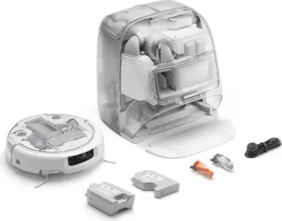 A disassembled robot vacuum cleaner and its components are laid out on a white background.