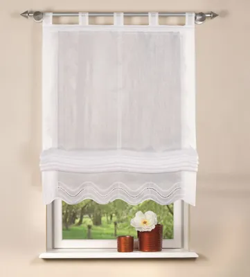 A white sheer curtain with decorative trim hangs in a window, with a view of trees and greenery outside. Two small decorative pots are on the windowsill.