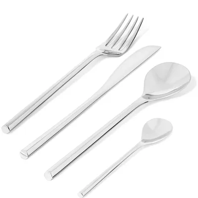 A set of four polished metal cutlery items arranged diagonally on a white background.