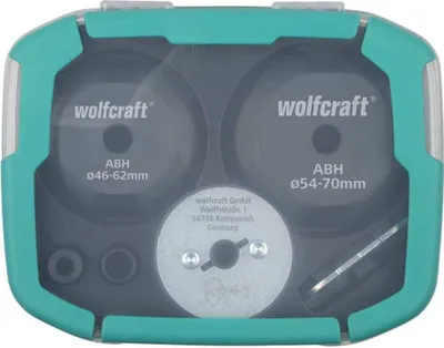 A set of hole saw accessories in a teal and gray plastic case.
