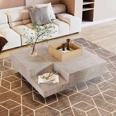 A modern living room with a sectional sofa, a concrete-effect coffee table, and a geometric rug.