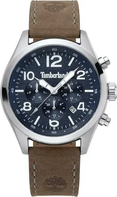 A close-up studio shot of a men's wristwatch with a blue dial and a brown leather strap.