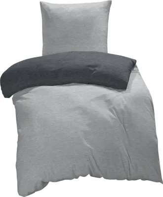 A duvet cover and pillowcase set, folded and arranged to display the product.