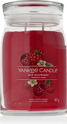 A Yankee Candle Red Raspberry scented candle in a glass jar with a lid.