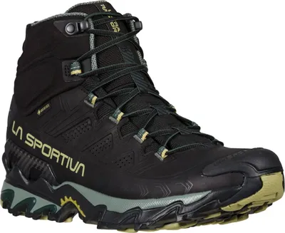 Schwarze Wanderschuhe "Ultra Raptor II Mid Leather GTX" von La Sportiva mit grünem Profil.
