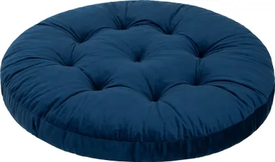 A round, tufted cushion in a deep blue color.