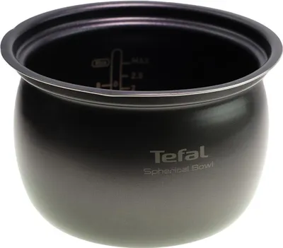 A close-up of a black spherical bowl with measurement markings inside.