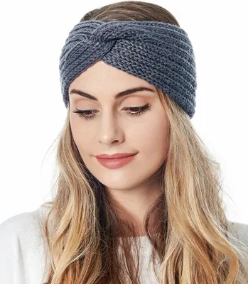 A woman wearing a knitted headband.