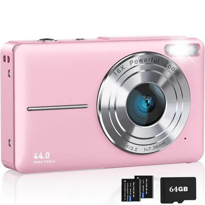 A pink digital camera is shown from the front, with accessories at the bottom.