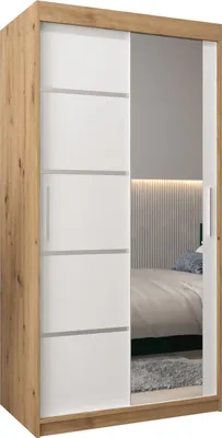 A sliding door wardrobe with a mirrored door, reflecting a bedroom interior.
