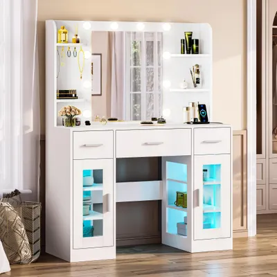 Produktbild von OYAJIA Schminktisch mit Spiegel, Holzspanplatte und Glas, RGB-Beleuchtung und Steckdose, 3 Schubladen+4 offene Fächer, ohne Hocker, 107 x 40 x 140cm