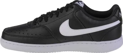 A side view of a black Nike Court Vision Lo NN sneaker with a white Nike swoosh.