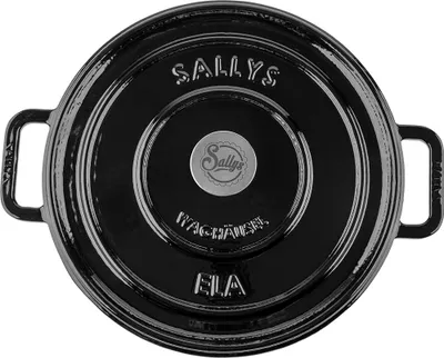 Top view of a black cast iron pot lid with embossed text and a central logo.