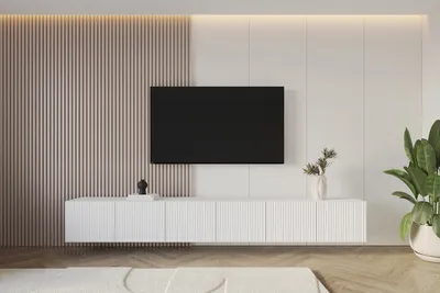 A modern living room with a wall-mounted TV cabinet and television.
